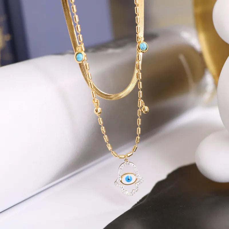 Collar Doble Mano Ojo Dorado