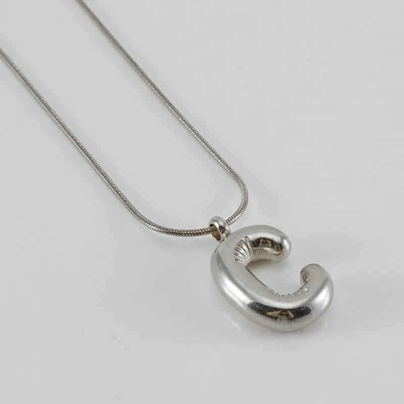 Collar Letra Globo Acero Inoxidable
